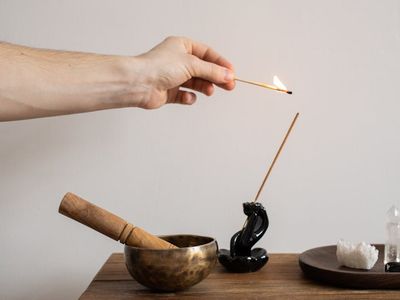 Incense sticks and a bowl of water.